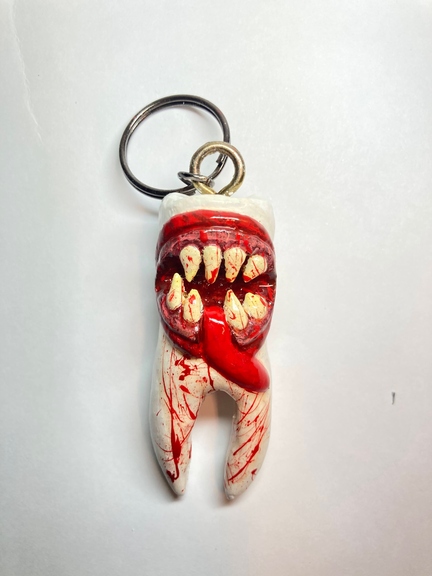 Tooth with teeth carving